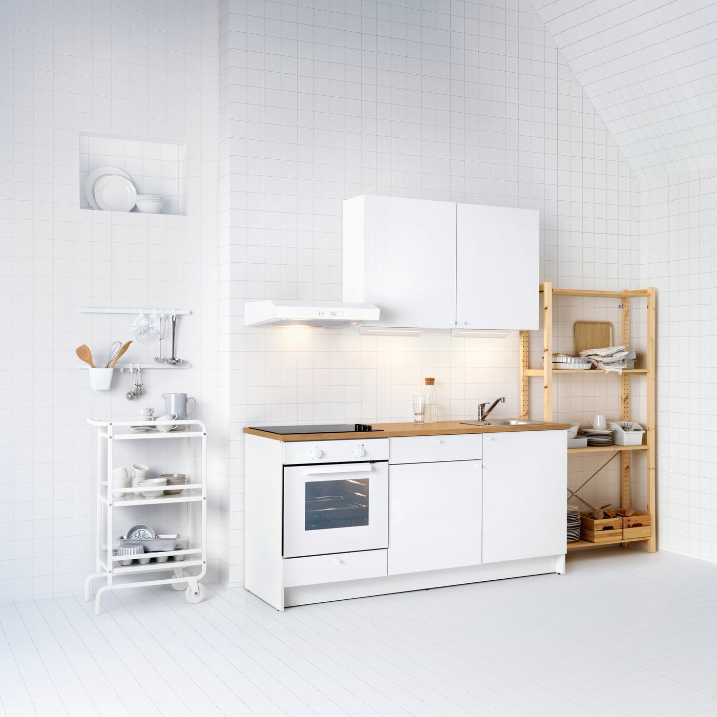 A white LAGAN wall mounted extractor hood in the kitchen