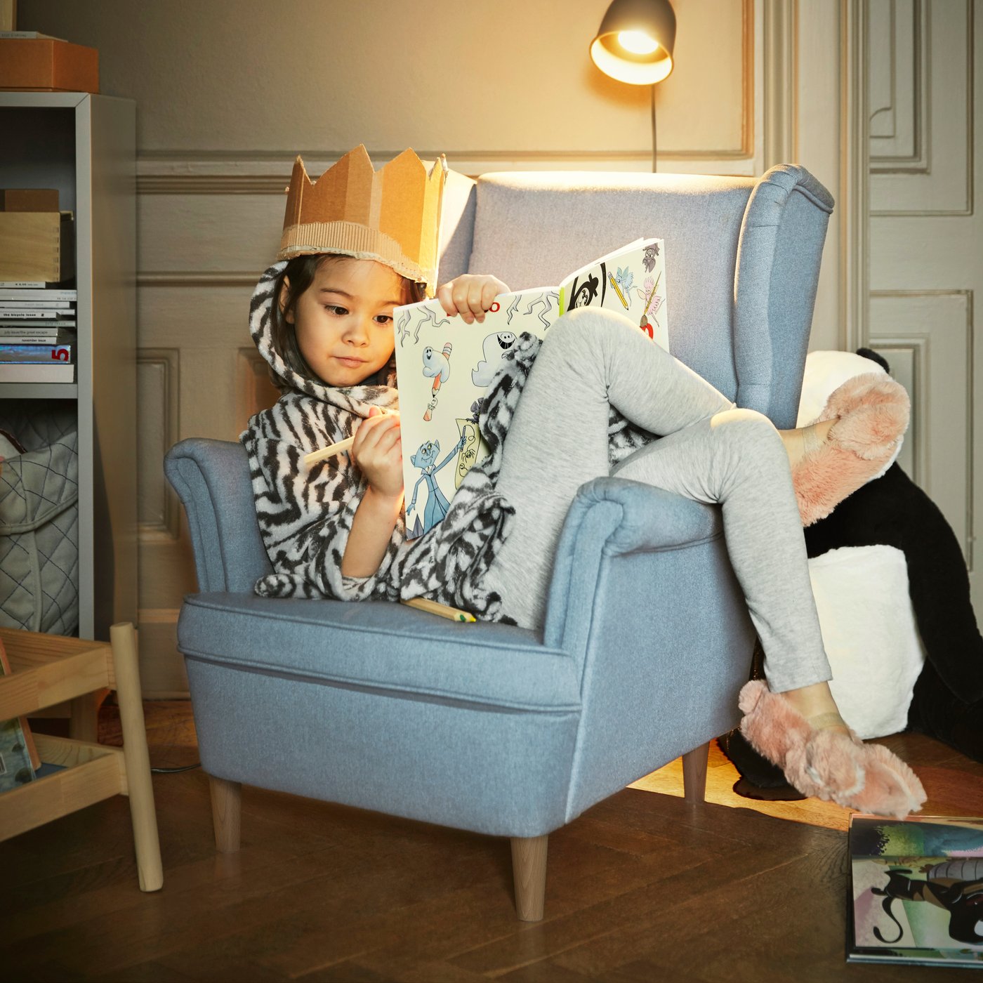 A Kilanda pale blue STRANDMON children's armchair