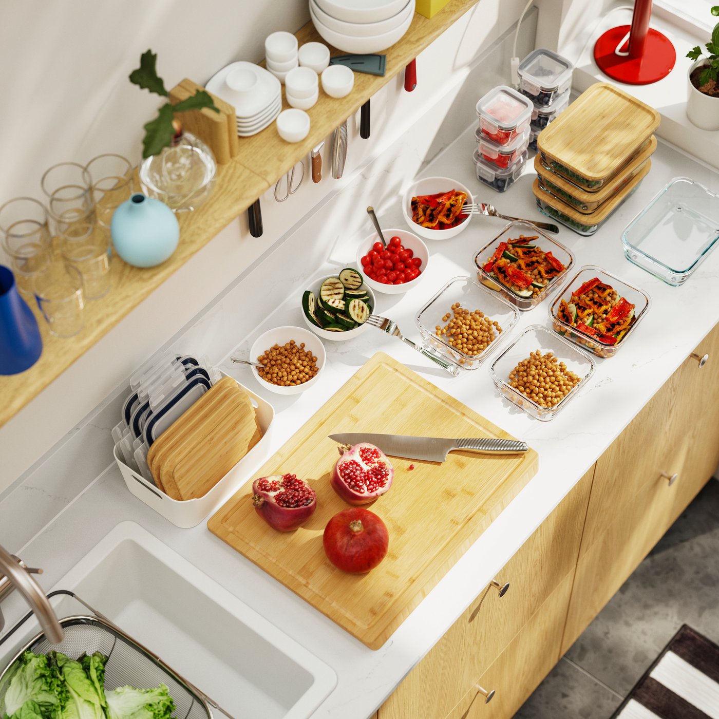 An eagle-eye’s view of a kitchen worktop with a chopping board and several food containers, where meals are being prepared.