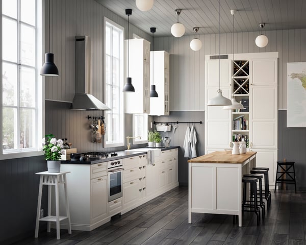 A white/Bodbyn off-white METOD base cabinet for oven with drawer in the kitchen