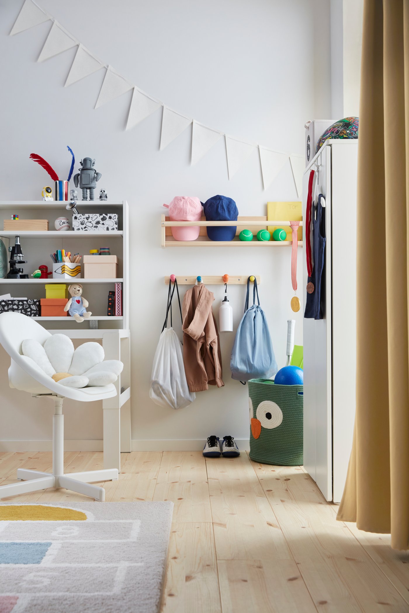 A white PÅHL desk top shelf in the childrens room