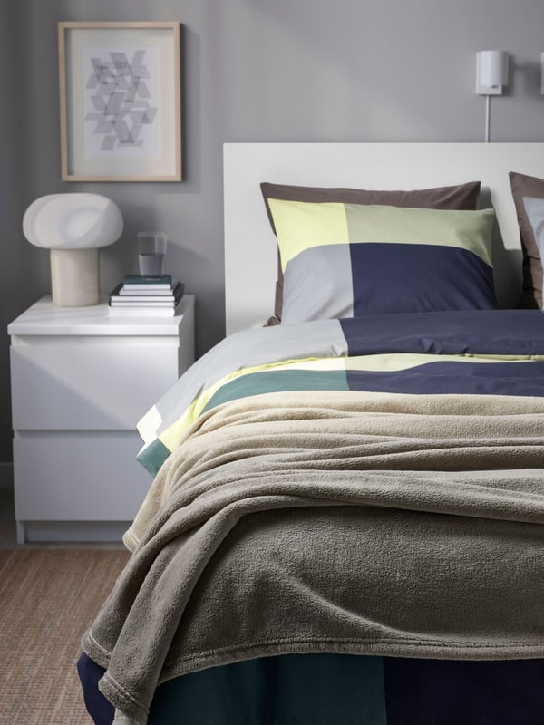 A light grey-green TRATTVIVA bedspread