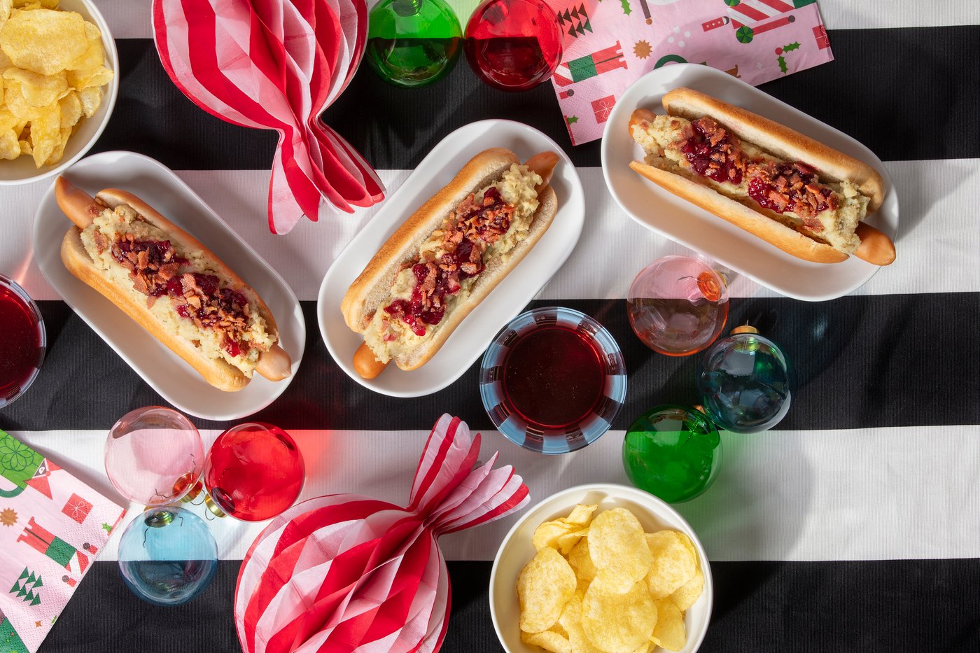 Festive hot dogs surrounded by Christmas decorations