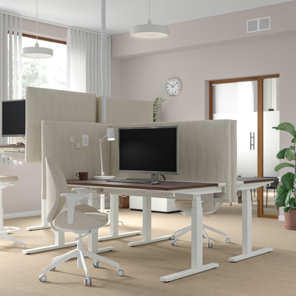 An electric walnut veneer/white MITTZON desk sit/stand