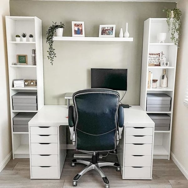 A white bookcase in a home office