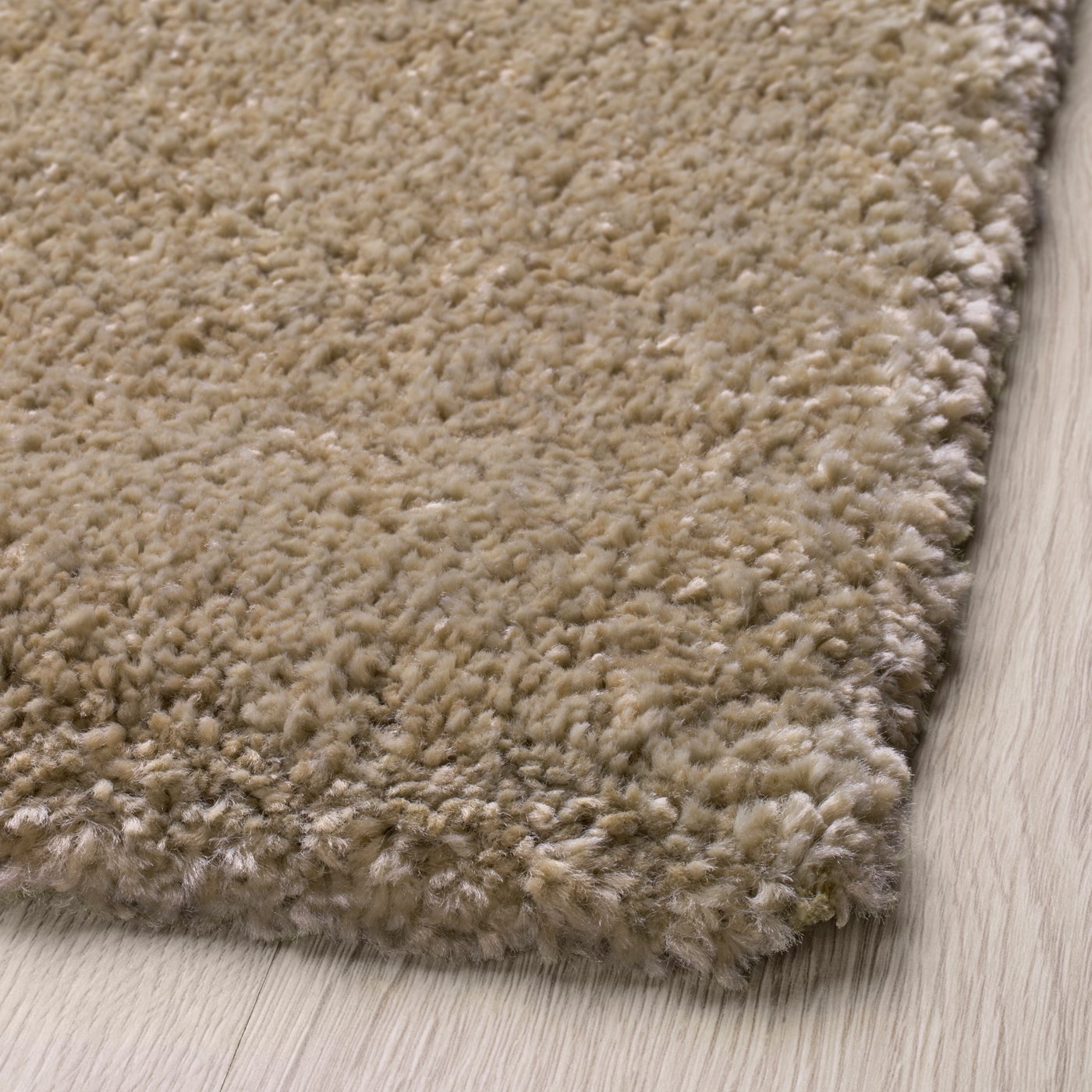 A beige STOENSE rug, low pile