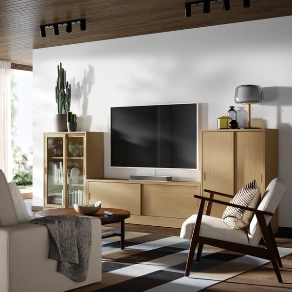 An oak veneer/clear glass TONSTAD TV/storage comb with sliding doors
