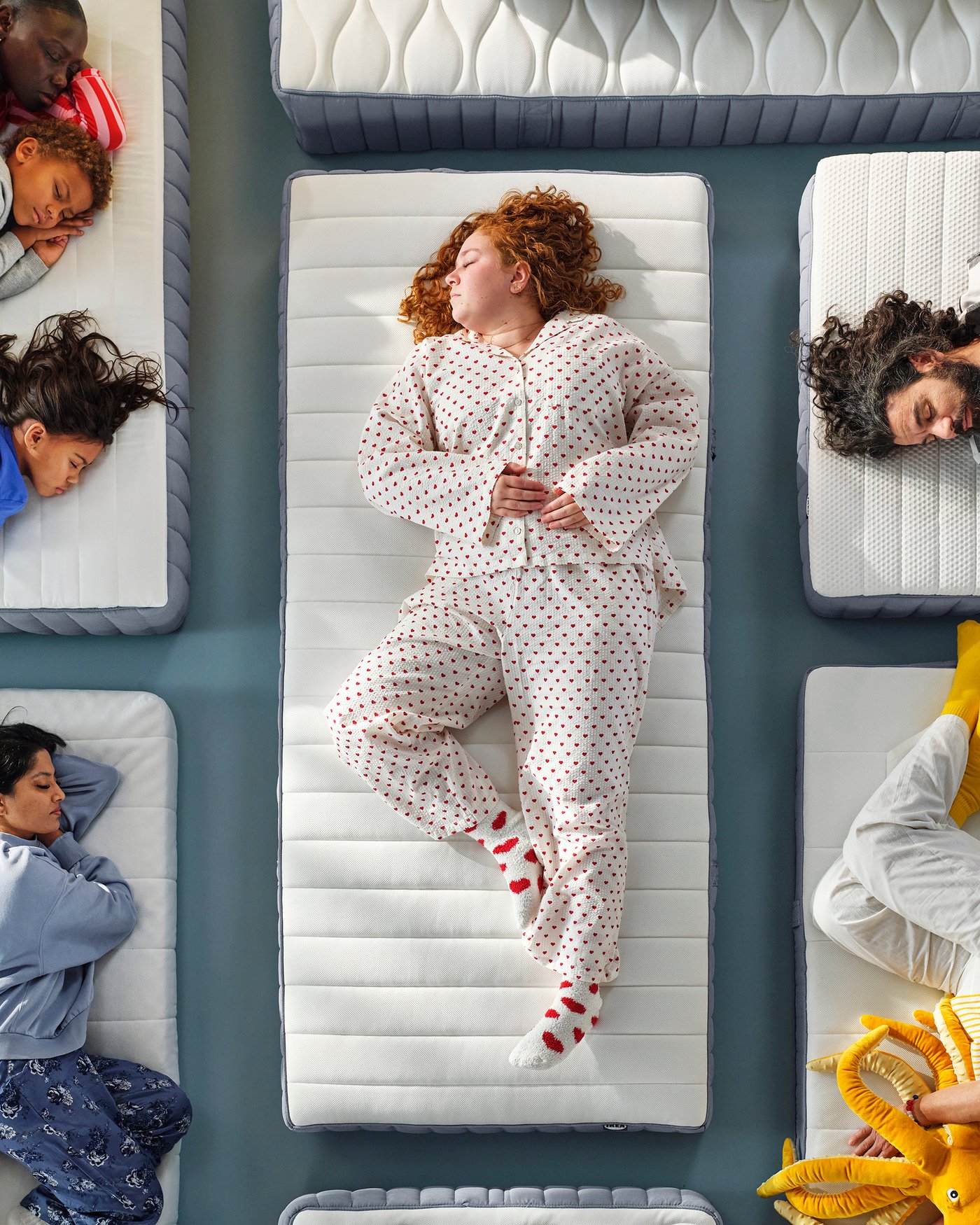 A firm/light blue VALEVÅG pocket sprung mattress