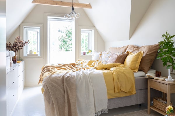 A yellow LUKTJASMIN duvet cover and pillowcase