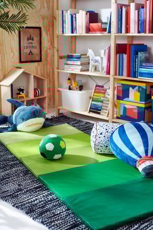 A green PLUFSIG folding gym mat