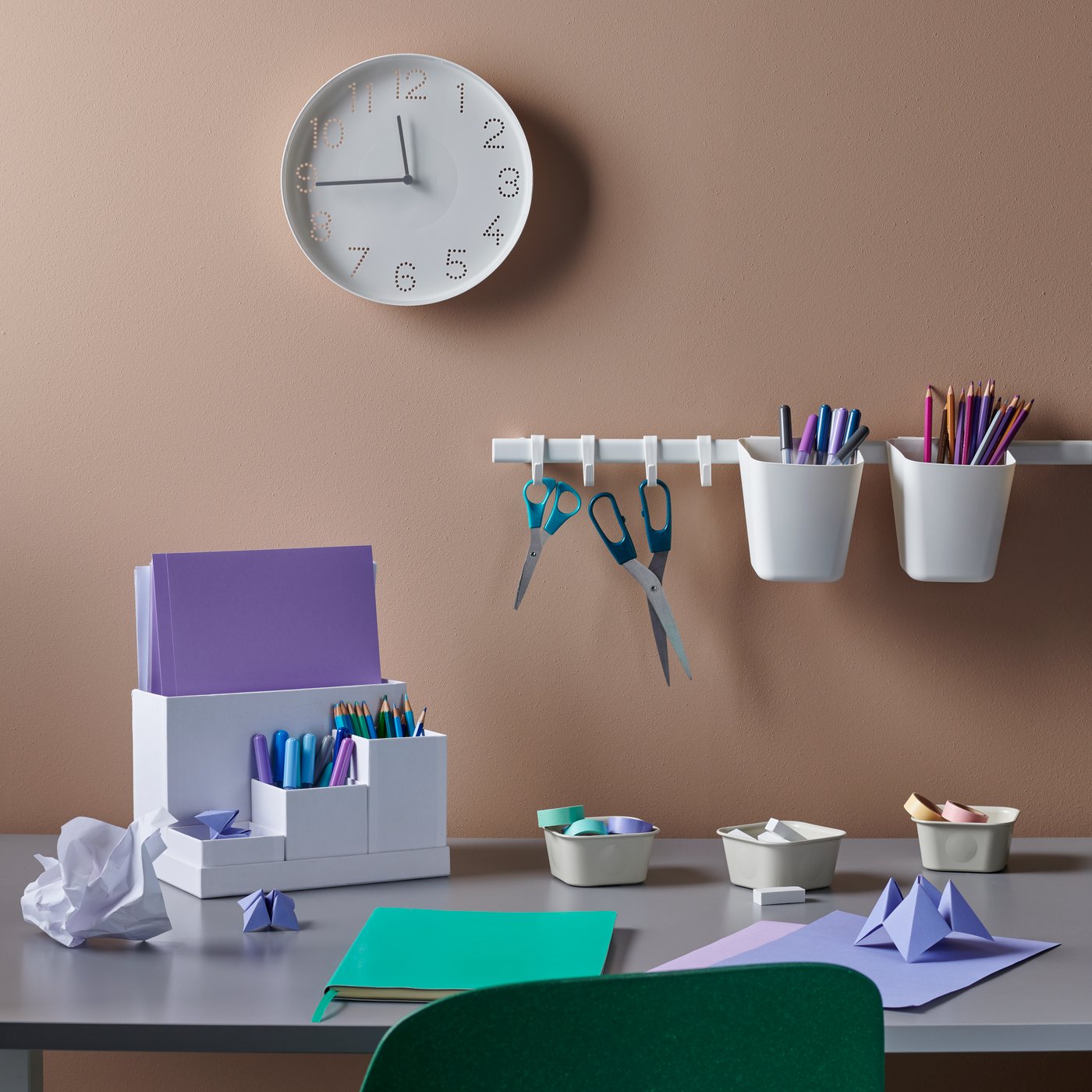 A white TROMMA wall clock in the home office