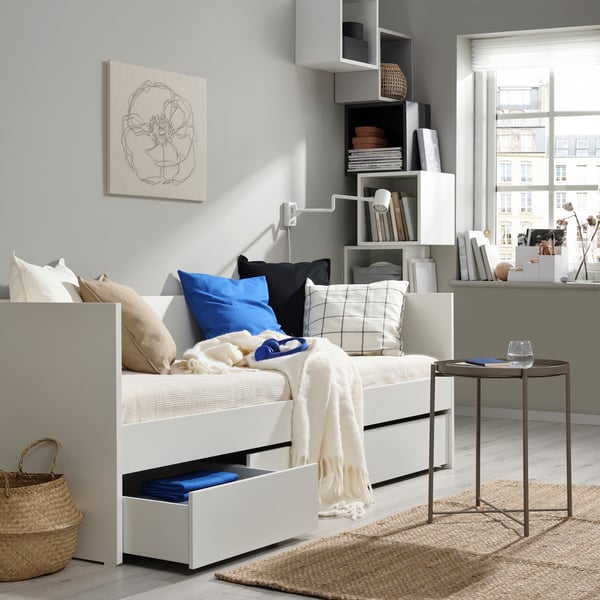 A white VIHALS day-bed frame with storage
