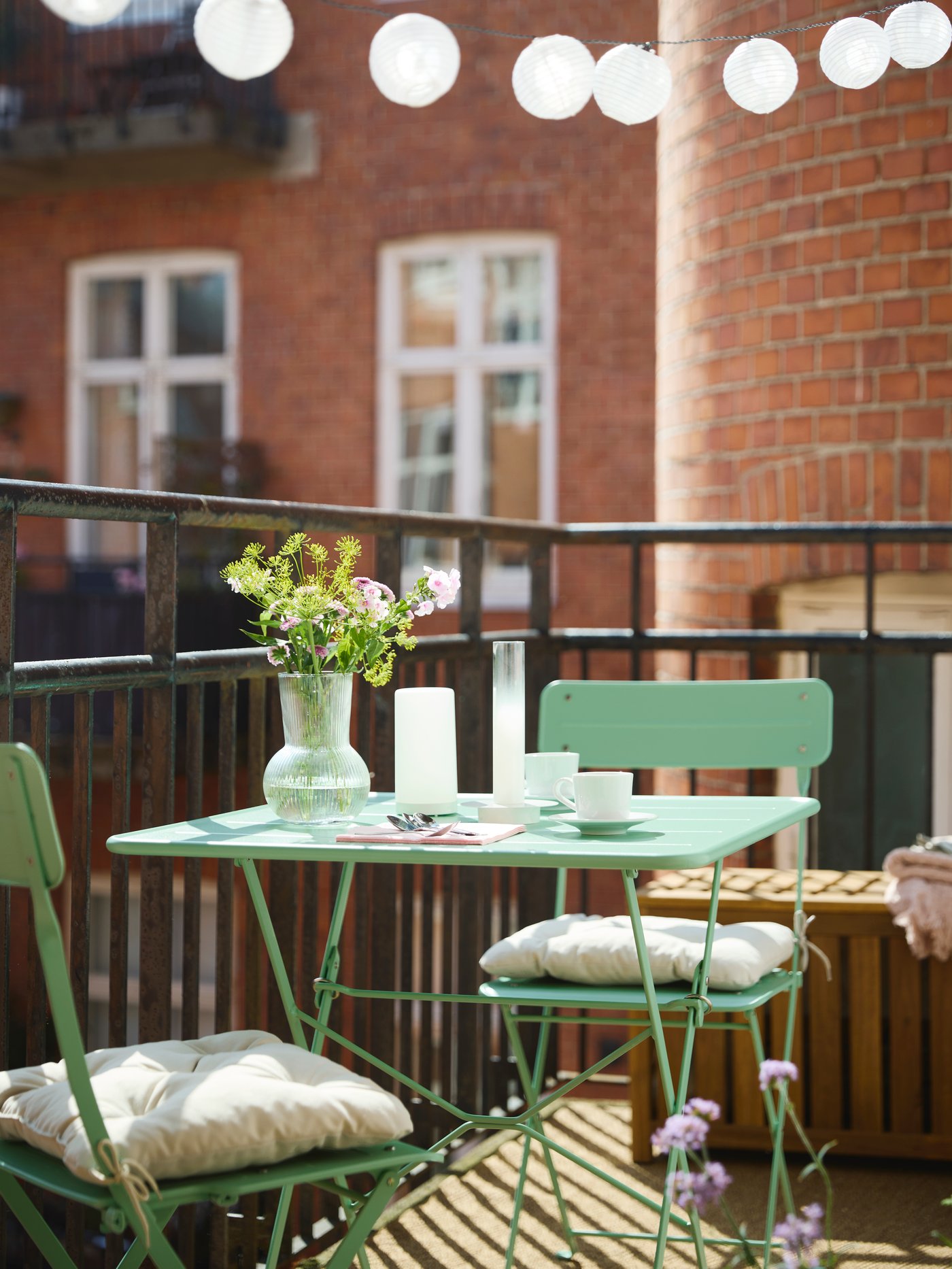 A light brown stained indoor /outdoor NÄMMARÖ storage box outside