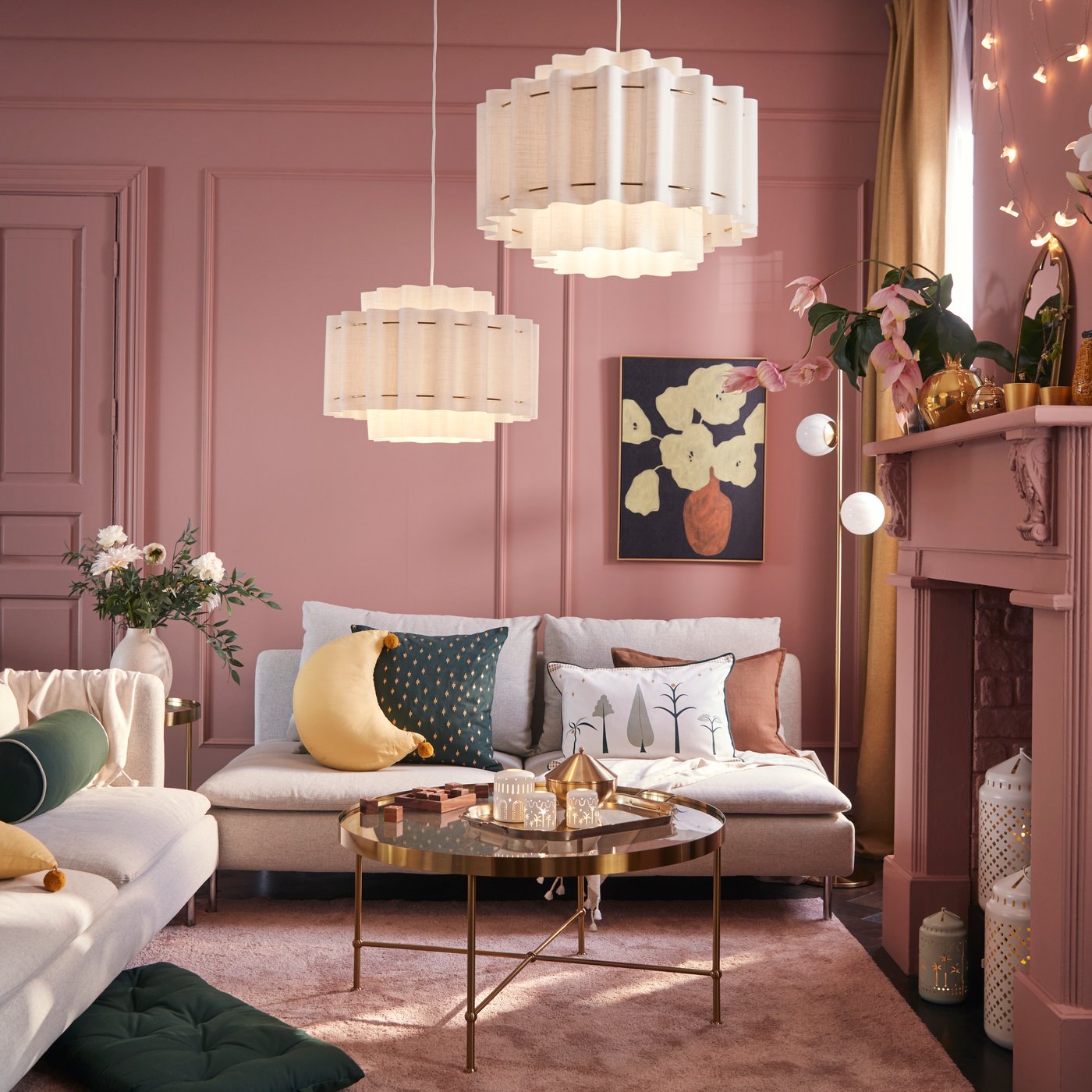 A gold effect/glass TORSJÖ coffee table in the living room and a SÖDERHAMN sofa.
