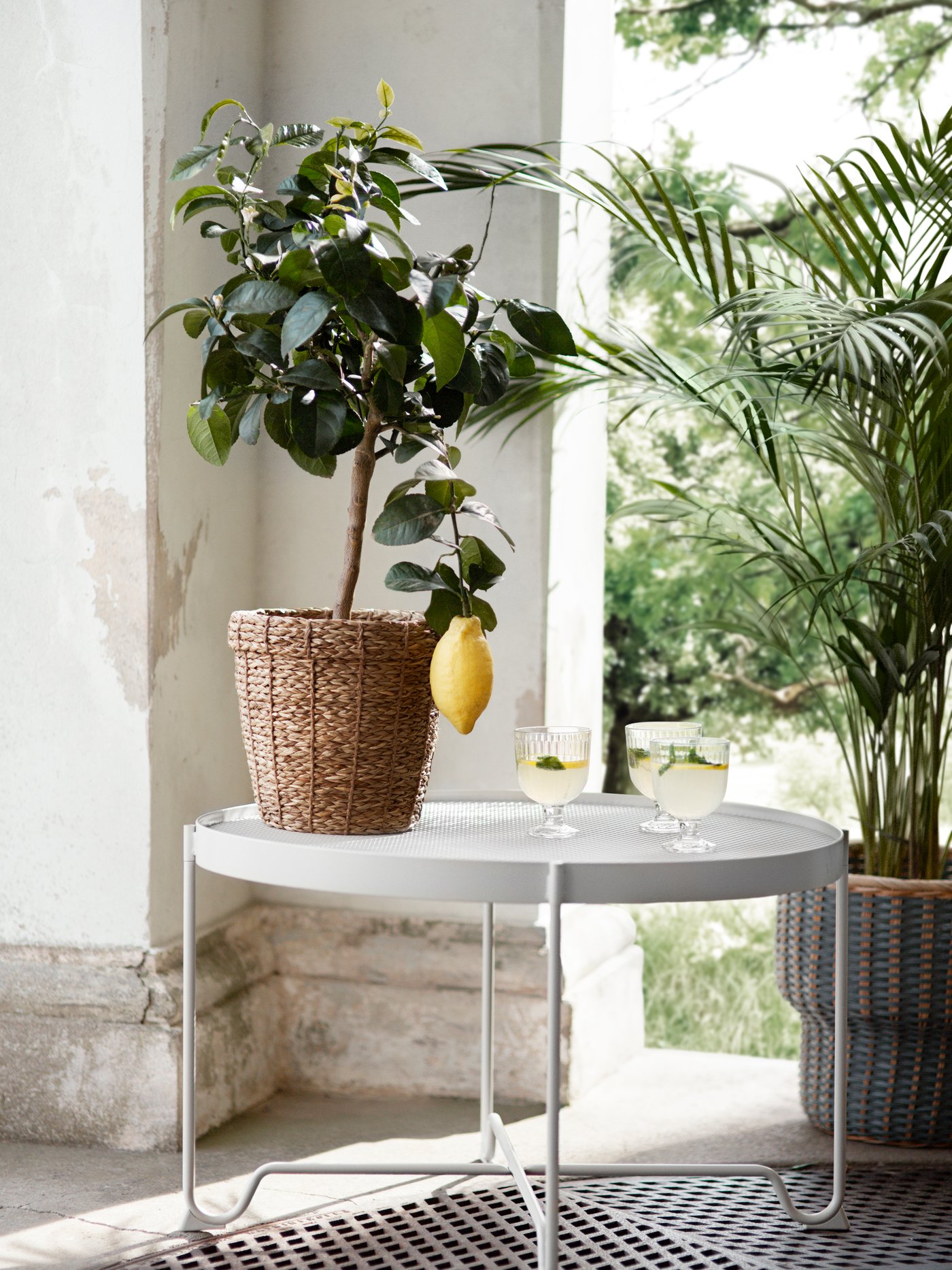 A beige KROKHOLMEN coffee table, outdoor