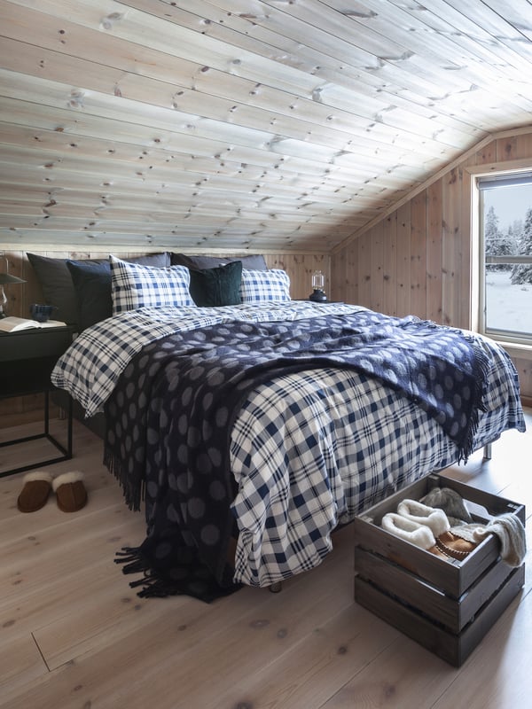 A black VIKHAMMER bedside table