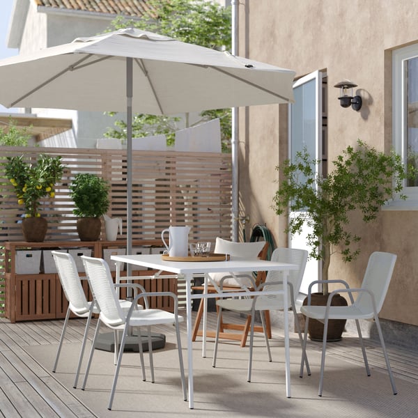 A foldable white/white TORPARÖ table+4 chairs w armrests, outdoor outside
