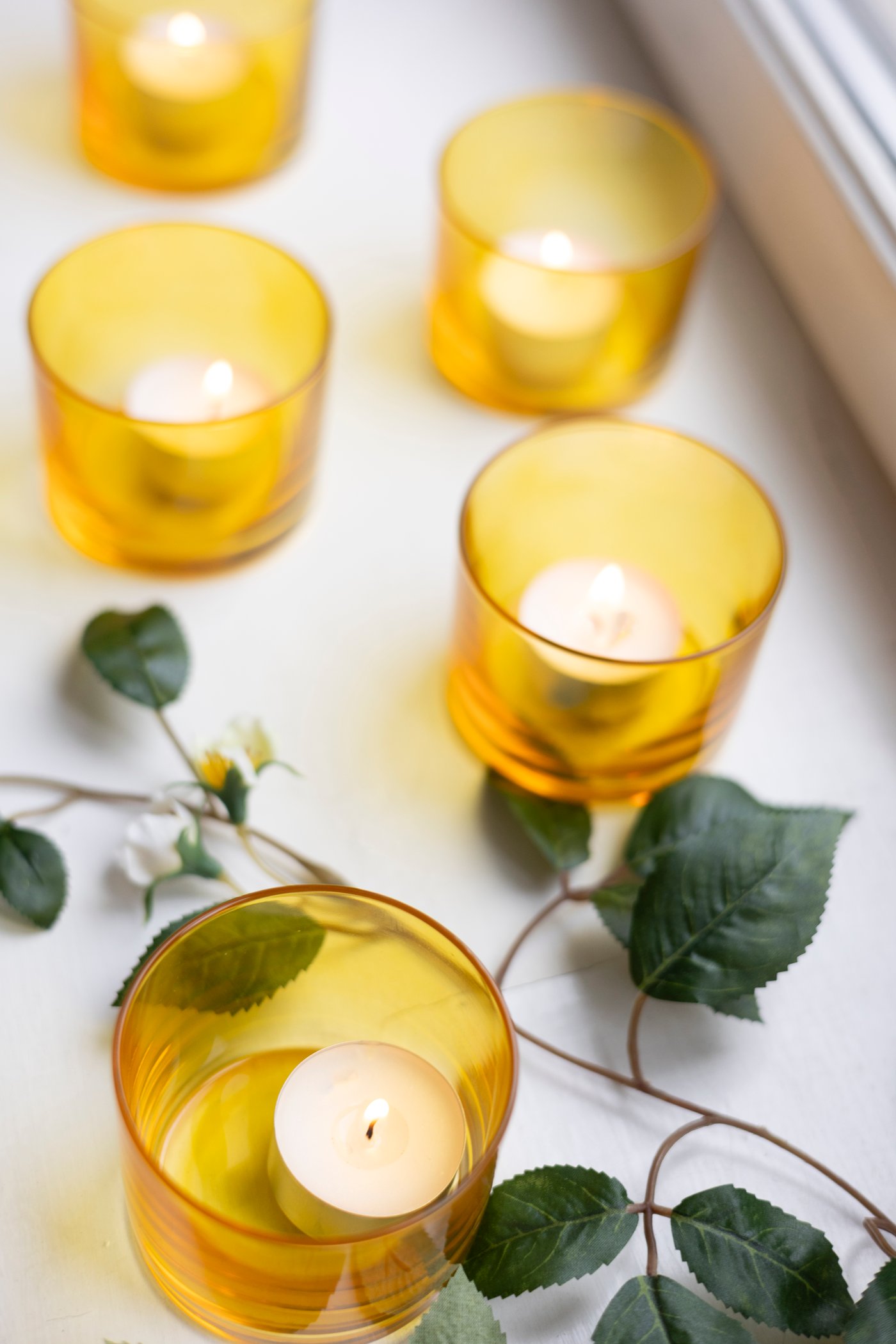 A bright yellow BUSKBJÖRK candle holder