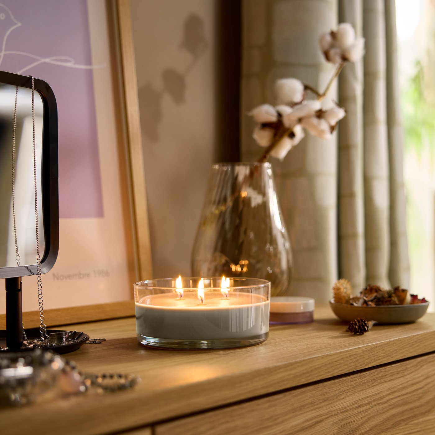 A Sandalwood & patchouli brown LOTSFÅGEL scented candle in glass, 3 wicks