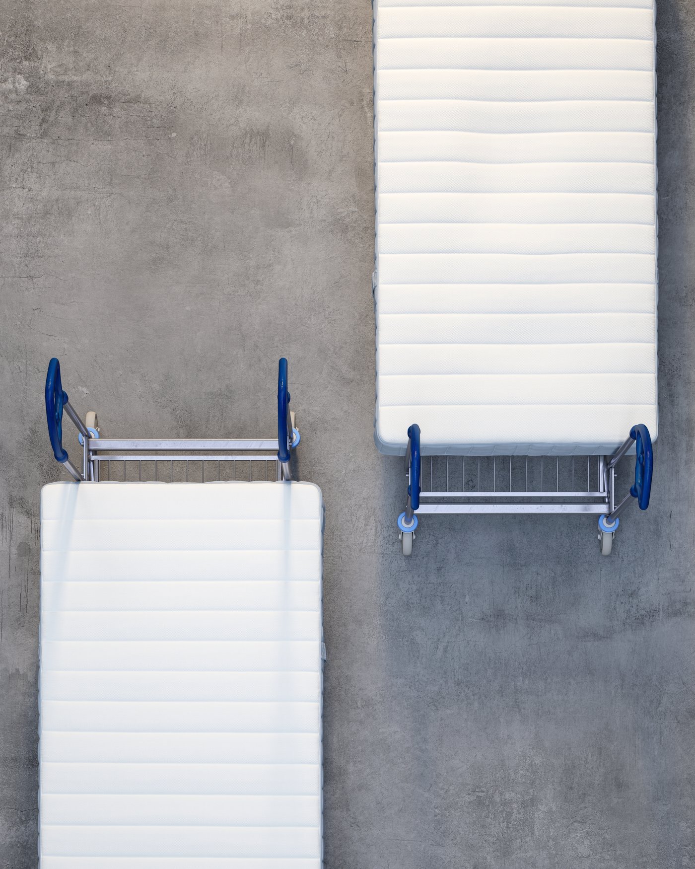 Two twin mattresses on carts