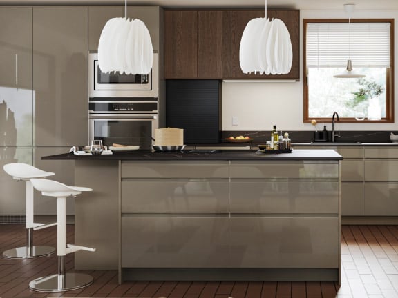 A high-gloss dark grey-brown VOXTORP drawer front