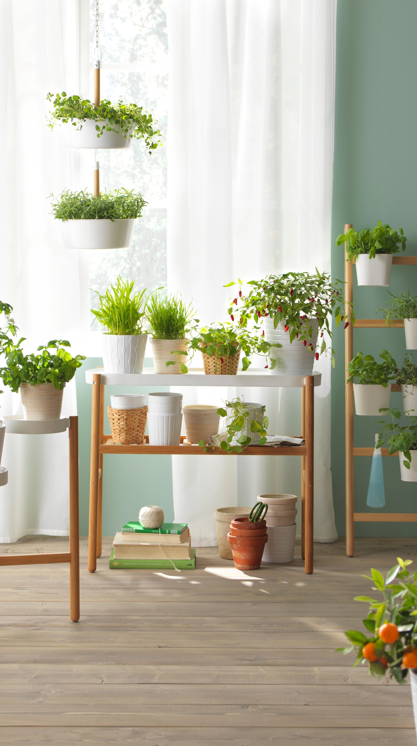 A grey-beige KLOTLÖNN plant pot with saucer.
