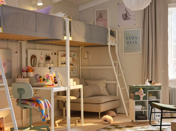 Two VITVAL loft beds and desk top are end-to-end along a beige wall with chairs in green and beige at the desks underneath.