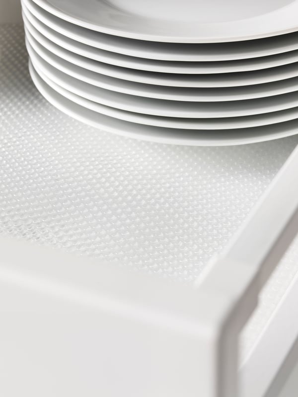 A transparent VARIERA drawer mat