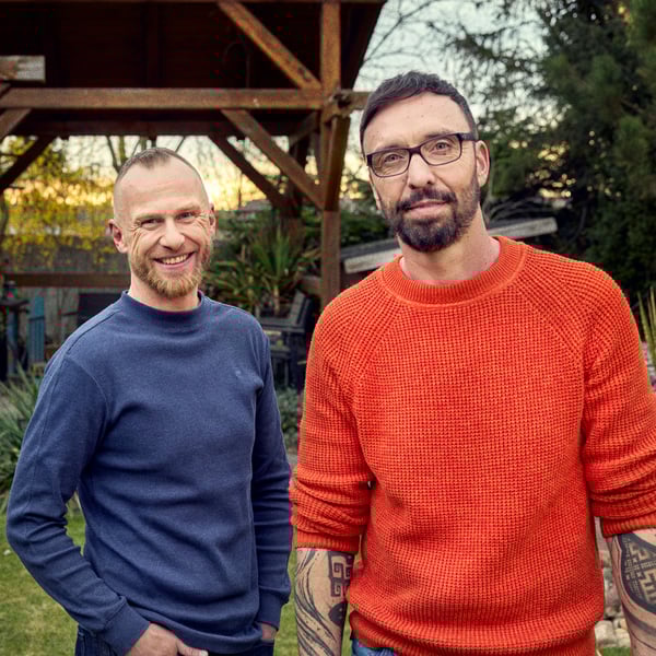 Daniel and his partner Martin in the garden in front of their house.