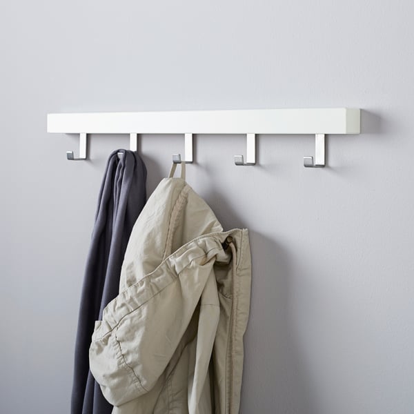A white TJUSIG hanger for door/wall