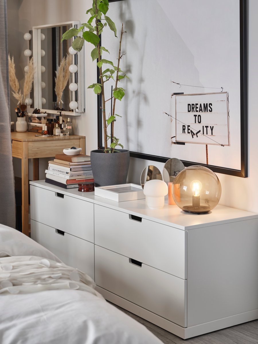 A bedroom with chic and accessible storage - IKEA