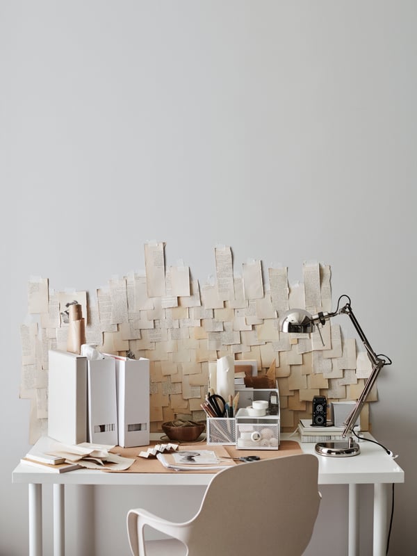 A white DRÖNJÖNS desk organiser in the home office