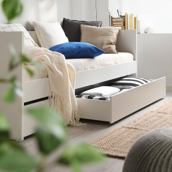 A white VIHALS day-bed frame with storage