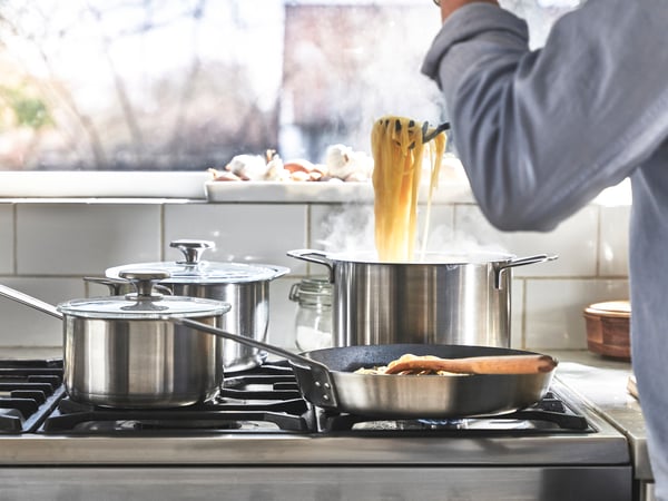 A stainless steel HEMKOMST 7-piece cookware set