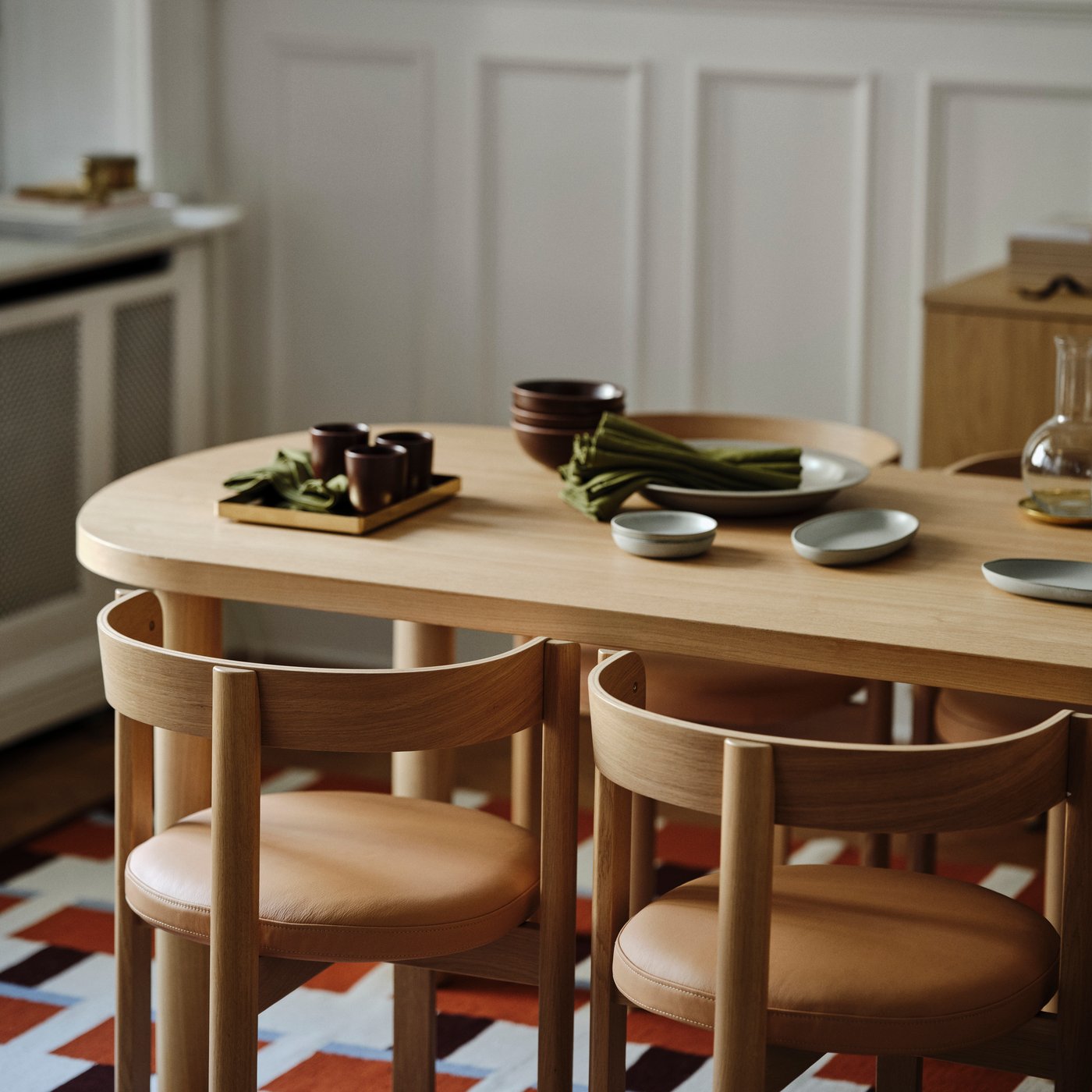 An oak/leather STOCKHOLM 2025 chair in the dining room