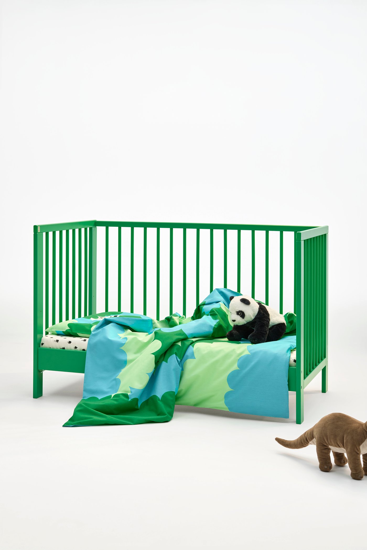 A green GULLIVER cot