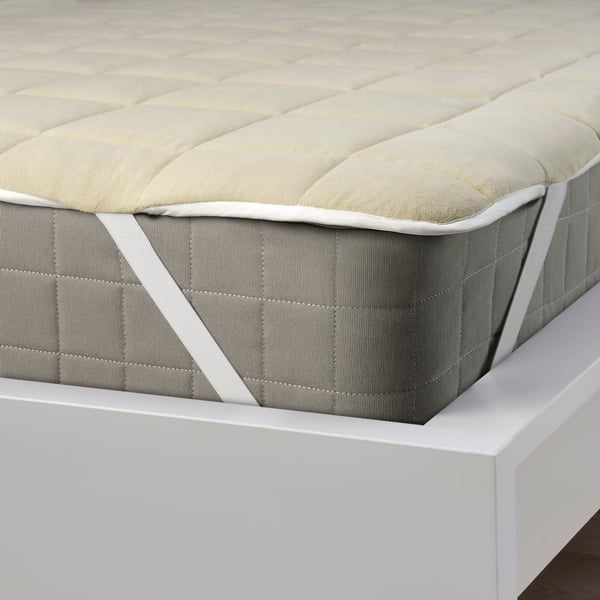 A beige/blue KEJSAROLVON mattress protector