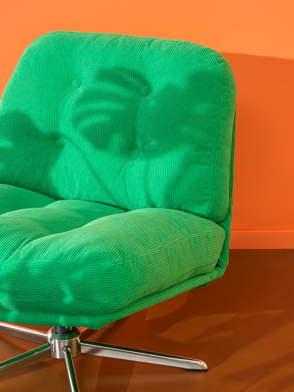 A Kelinge green DYVLINGE swivel armchair