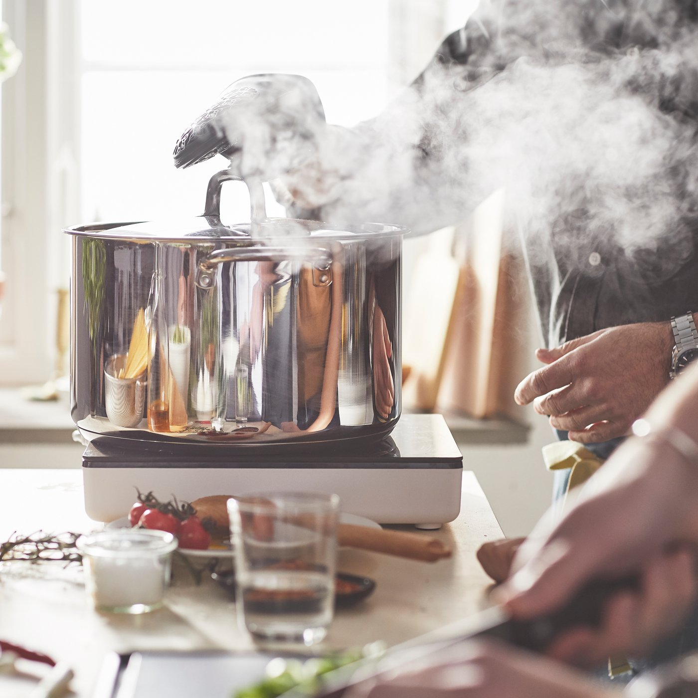 A stainless steel IKEA 365+ pot with lid