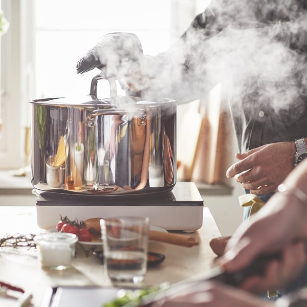 A stainless steel IKEA 365+ pot with lid