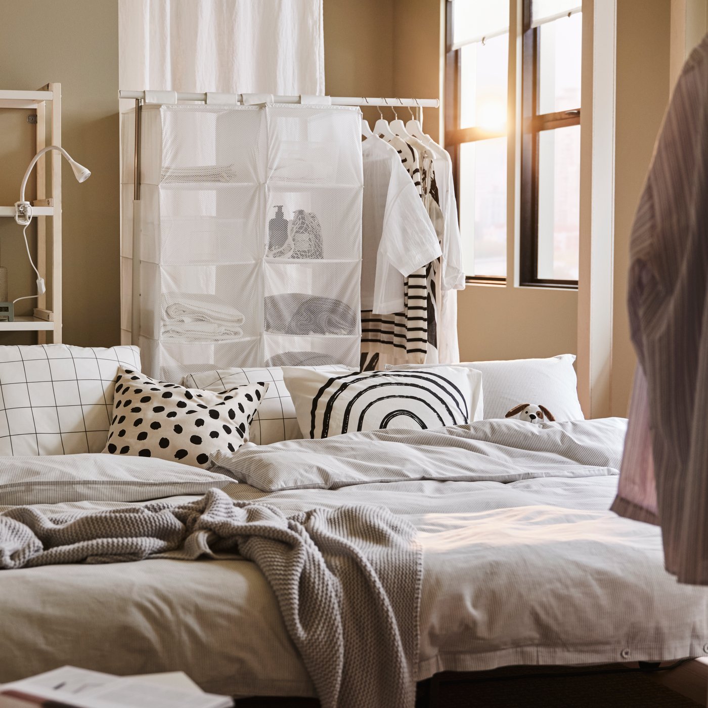 An off-white/dot pattern black ODDNY cushion cover