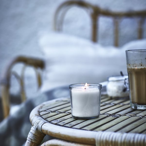 A Vanilla/light beige JÄMLIK scented candle in glass