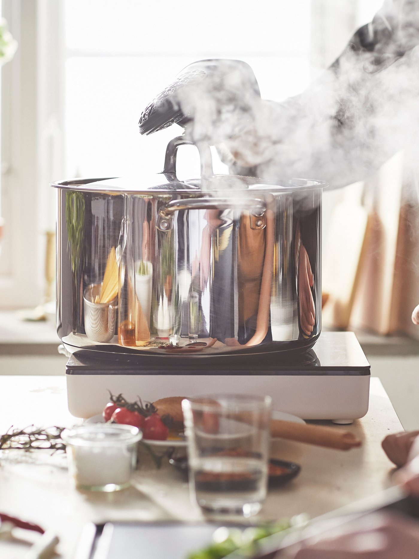 A stainless steel IKEA 365+ pot with lid