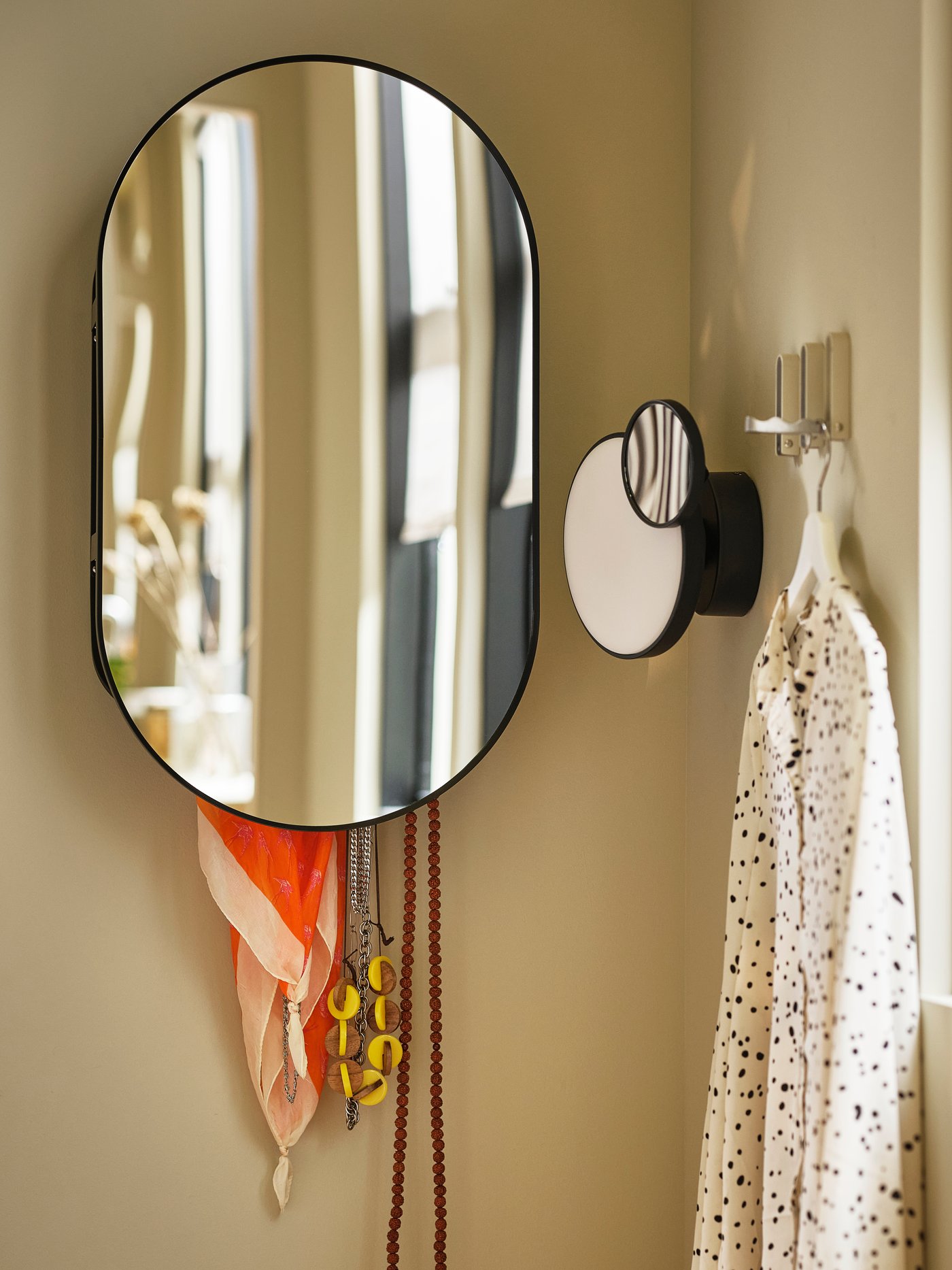 A black LINDBYN mirror with storage