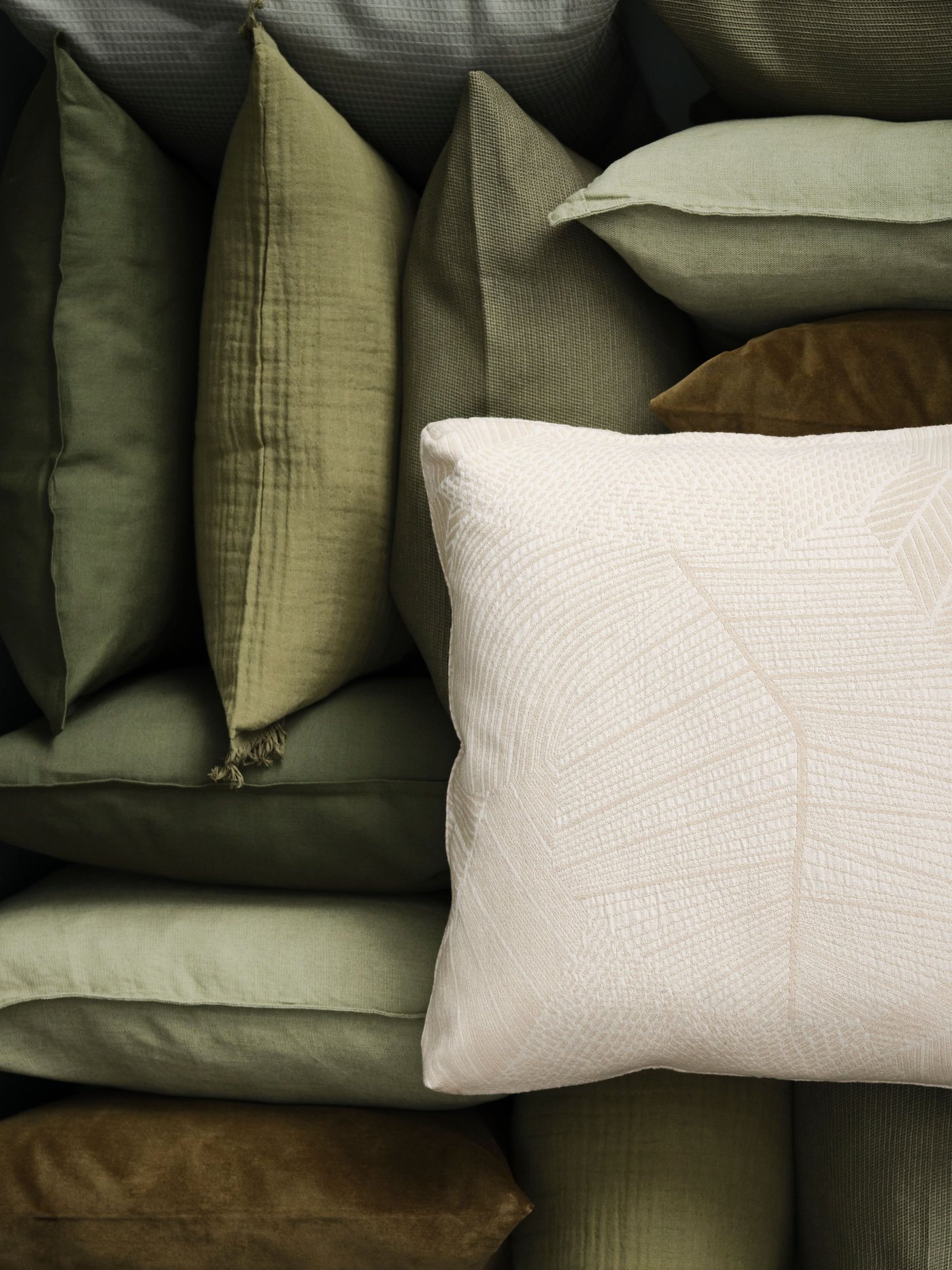 A grey-green VALLKRASSING cushion cover