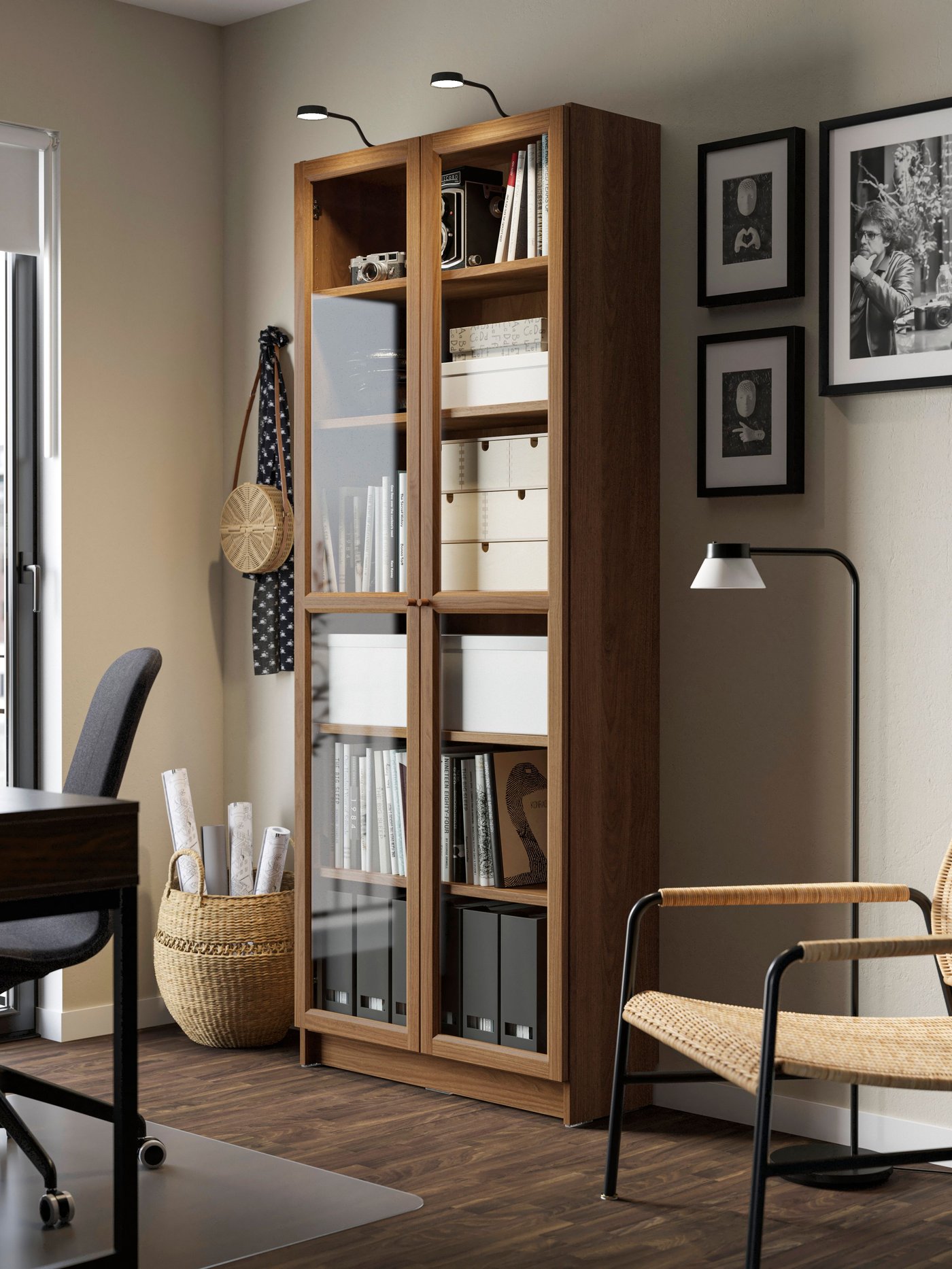 A brown walnut effect BILLY bookcase with glass doors in the home office