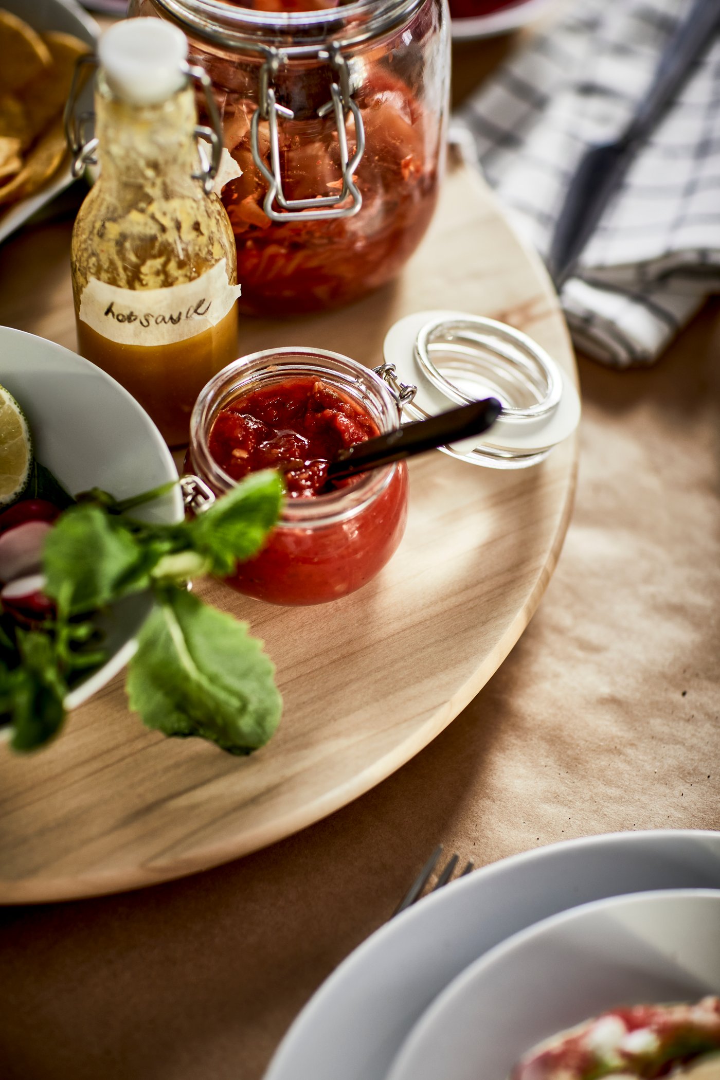 A clear glass KORKEN jar with lid