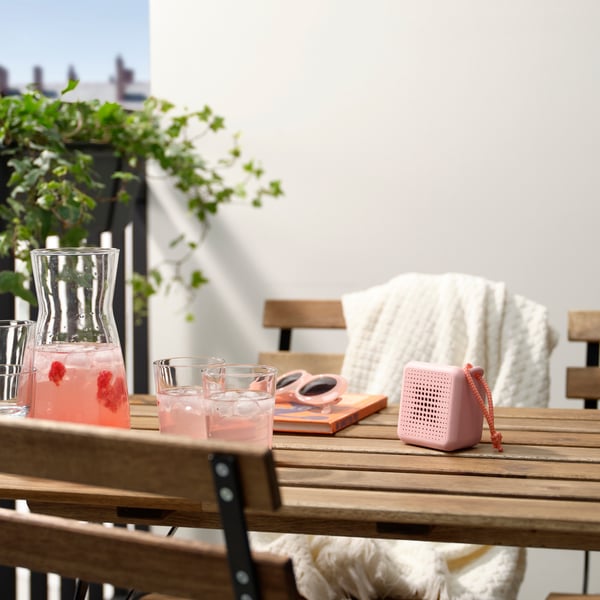 A waterproof/pink VAPPEBY portable bluetooth speaker