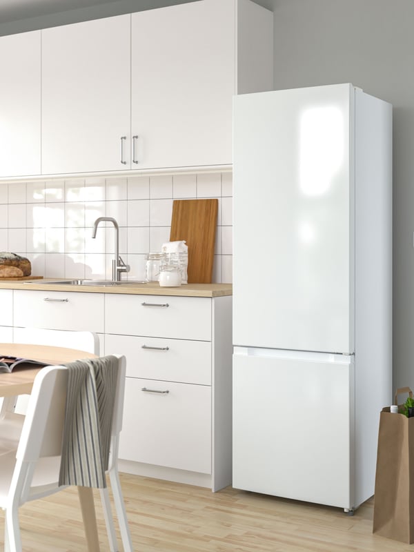 A freestanding/white LAGAN fridge/freezer in the kitchen