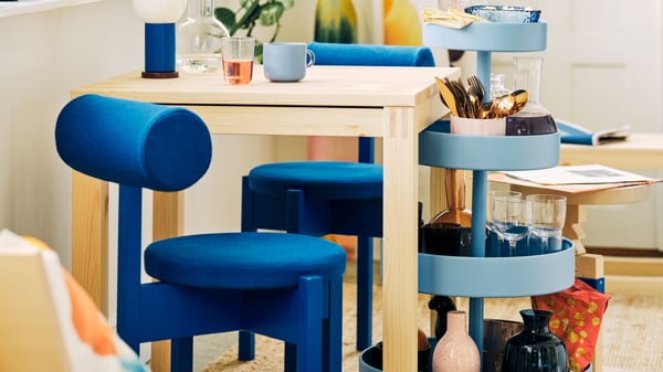 A blue IKEA PS 2026 trolley in the dining room